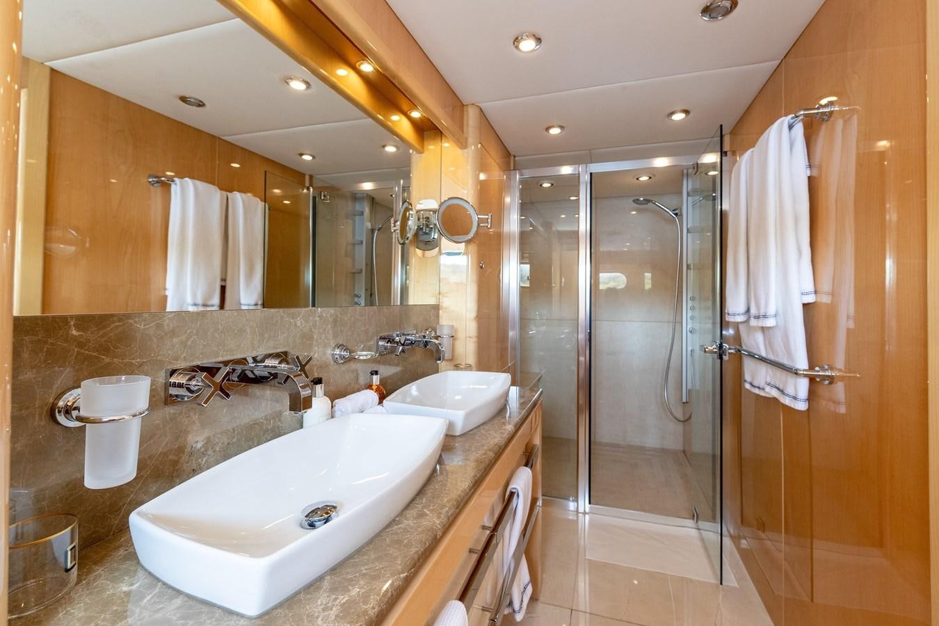 a bathroom with a large mirror aboard KING OF OIL Yacht for Sale