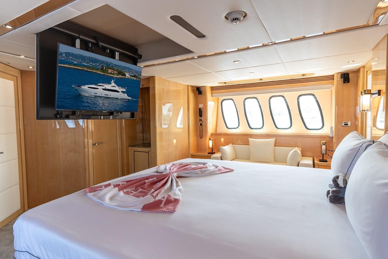 a bedroom with a large tv aboard KING OF OIL Yacht for Sale