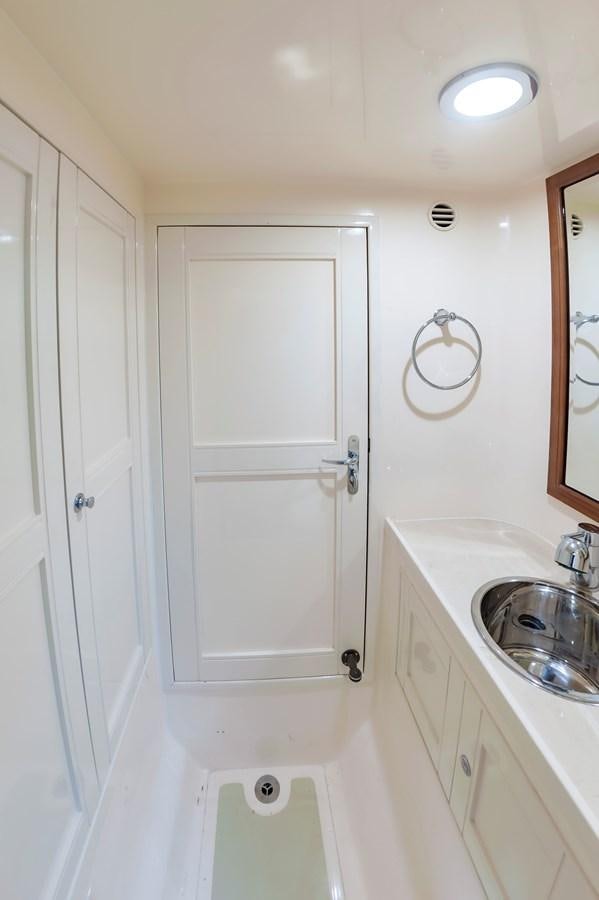 a bathroom with a sink and a toilet aboard UNDERDOG Yacht for Sale