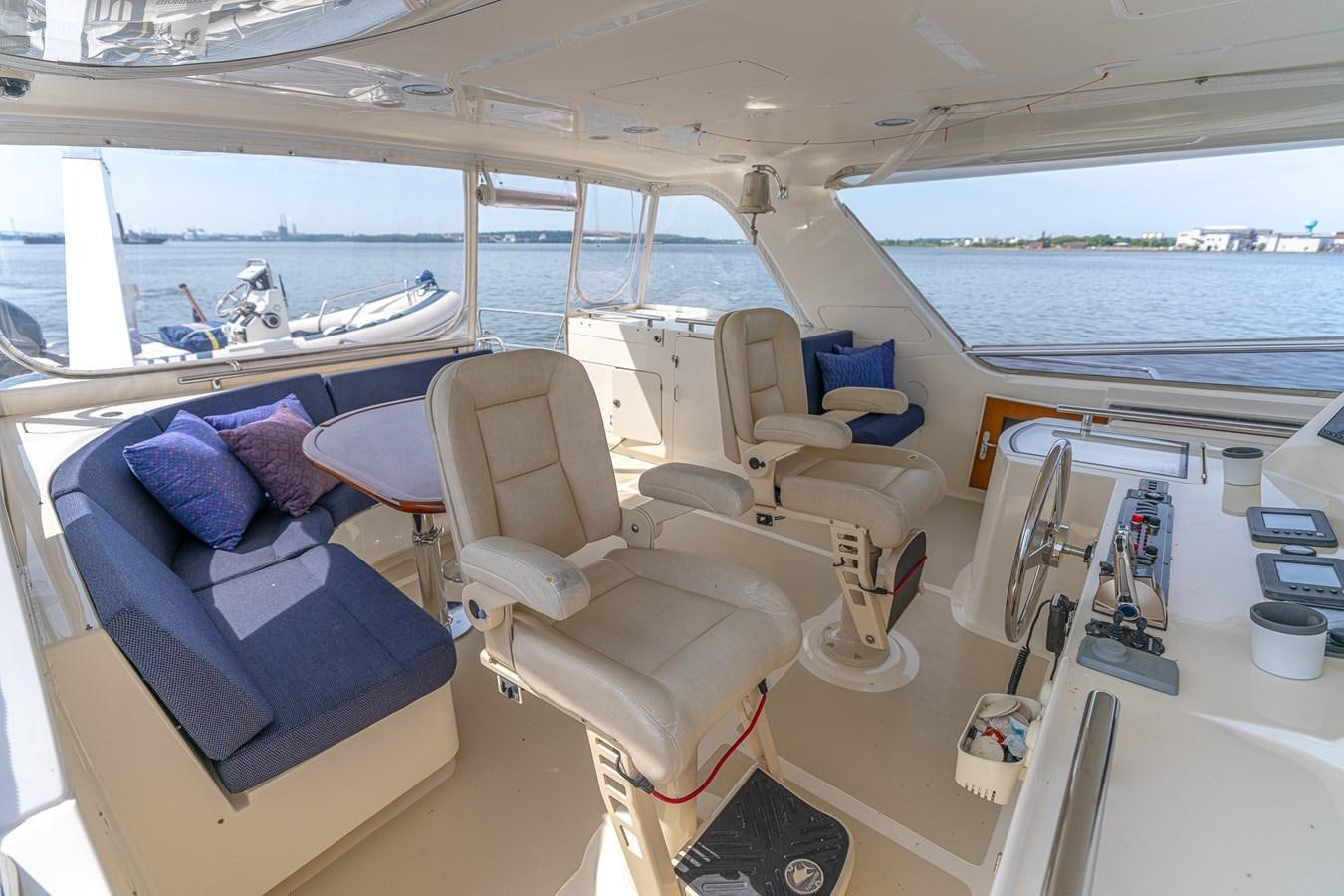 a boat with a view of the ocean and the deck aboard UNDERDOG Yacht for Sale