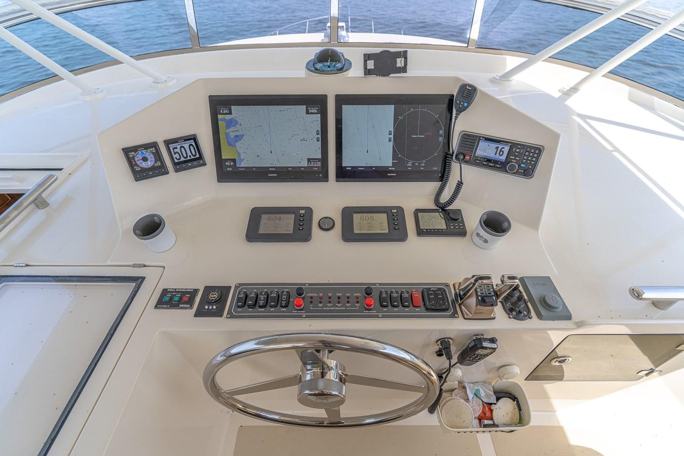 a white control panel with buttons and buttons aboard UNDERDOG Yacht for Sale