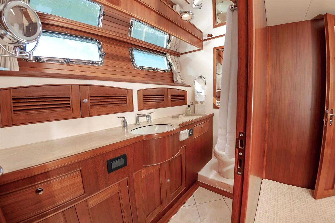 a bathroom with a sink and a mirror aboard UNDERDOG Yacht for Sale