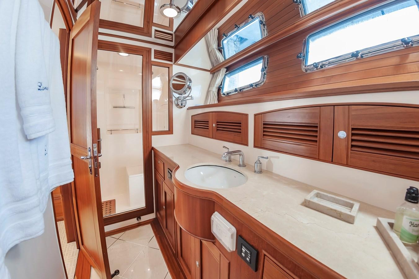a bathroom with a sink and cabinets aboard UNDERDOG Yacht for Sale