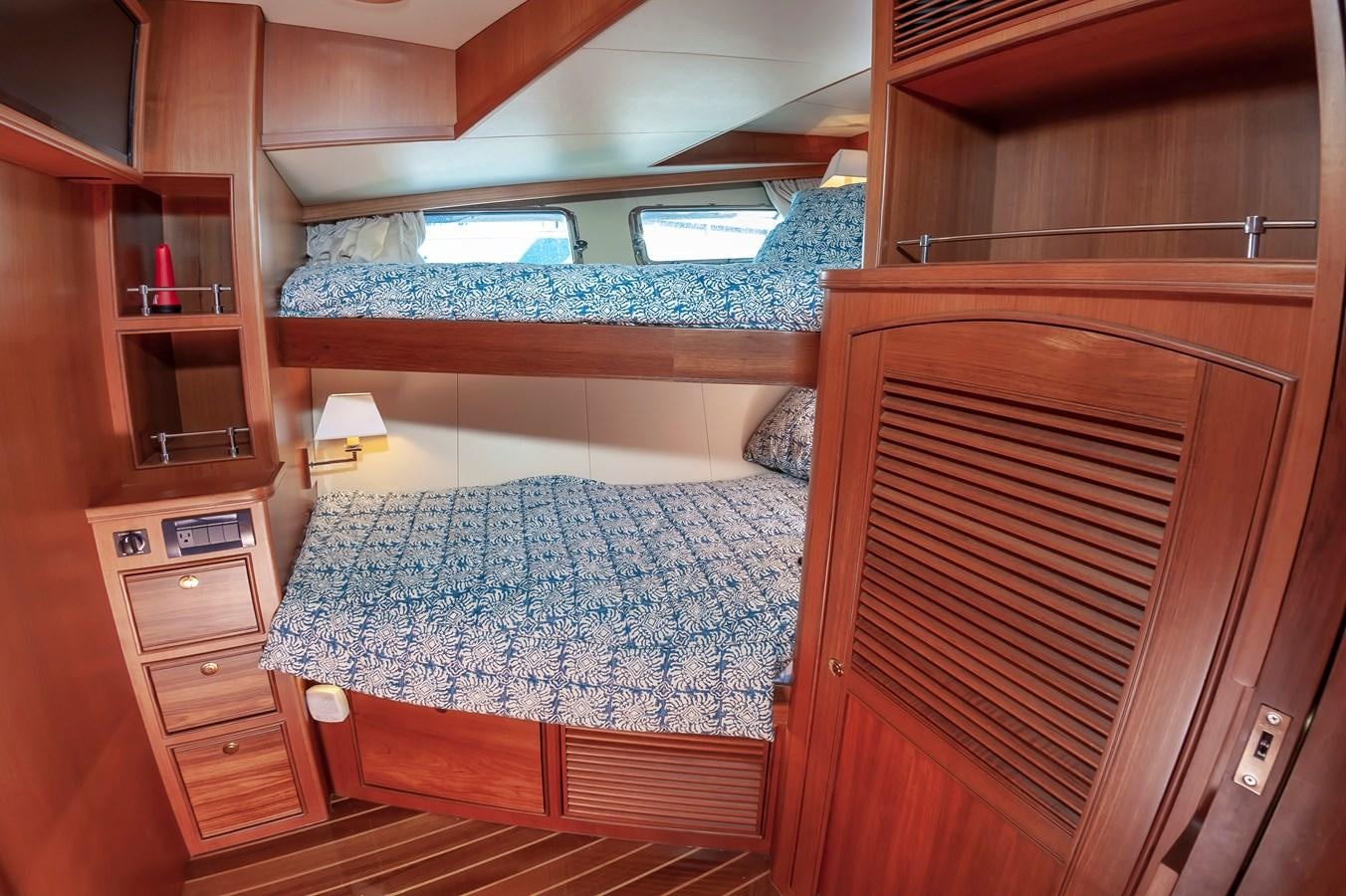 a bed in a room aboard UNDERDOG Yacht for Sale