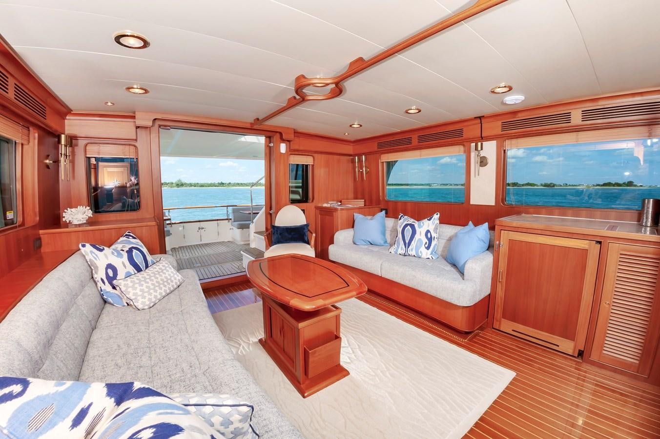 a bedroom with a bed and a table aboard UNDERDOG Yacht for Sale