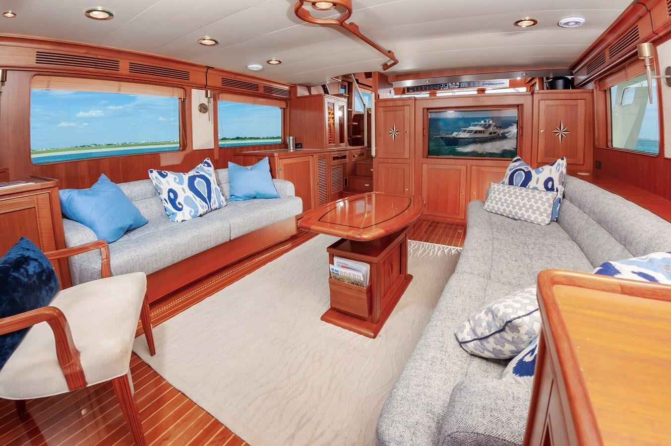 a living room with a couch and a television aboard UNDERDOG Yacht for Sale
