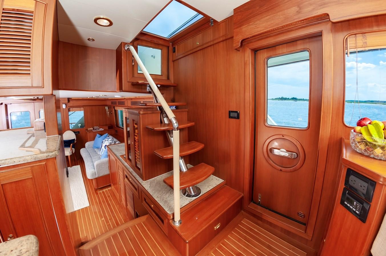 a kitchen with wooden cabinets aboard UNDERDOG Yacht for Sale