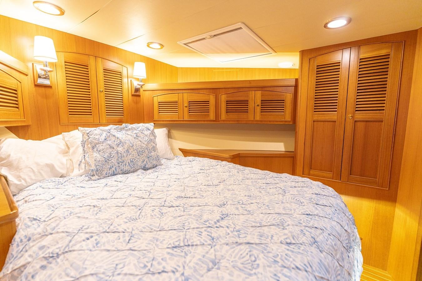a bed with white sheets aboard UNDERDOG Yacht for Sale