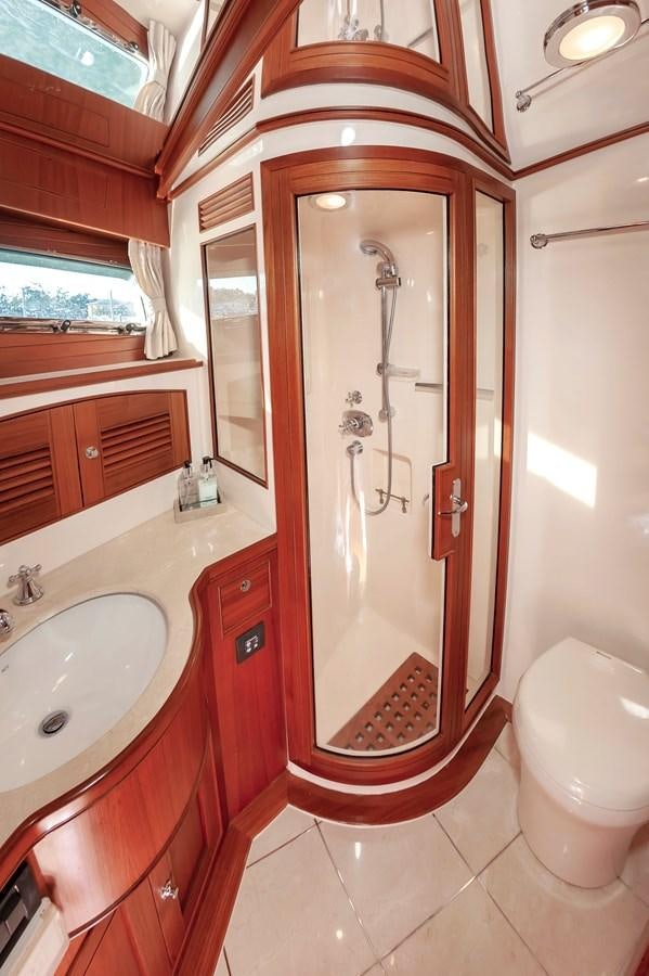 a bathroom with a sink and a toilet aboard UNDERDOG Yacht for Sale