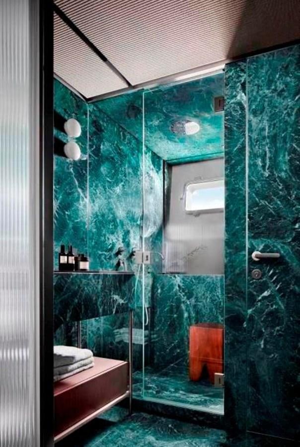 a bathroom with glass walls aboard HM 1 Yacht for Sale