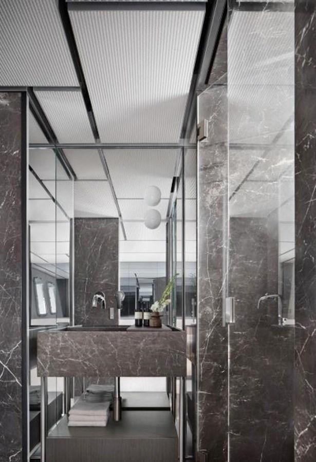 a bathroom with a marble countertop aboard HM 1 Yacht for Sale