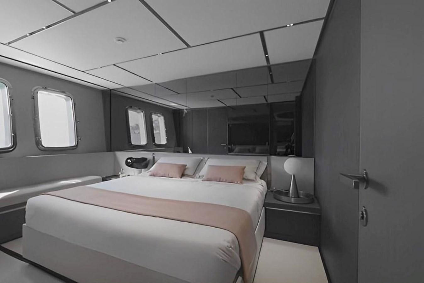 a room with a bed and a desk aboard HM 1 Yacht for Sale
