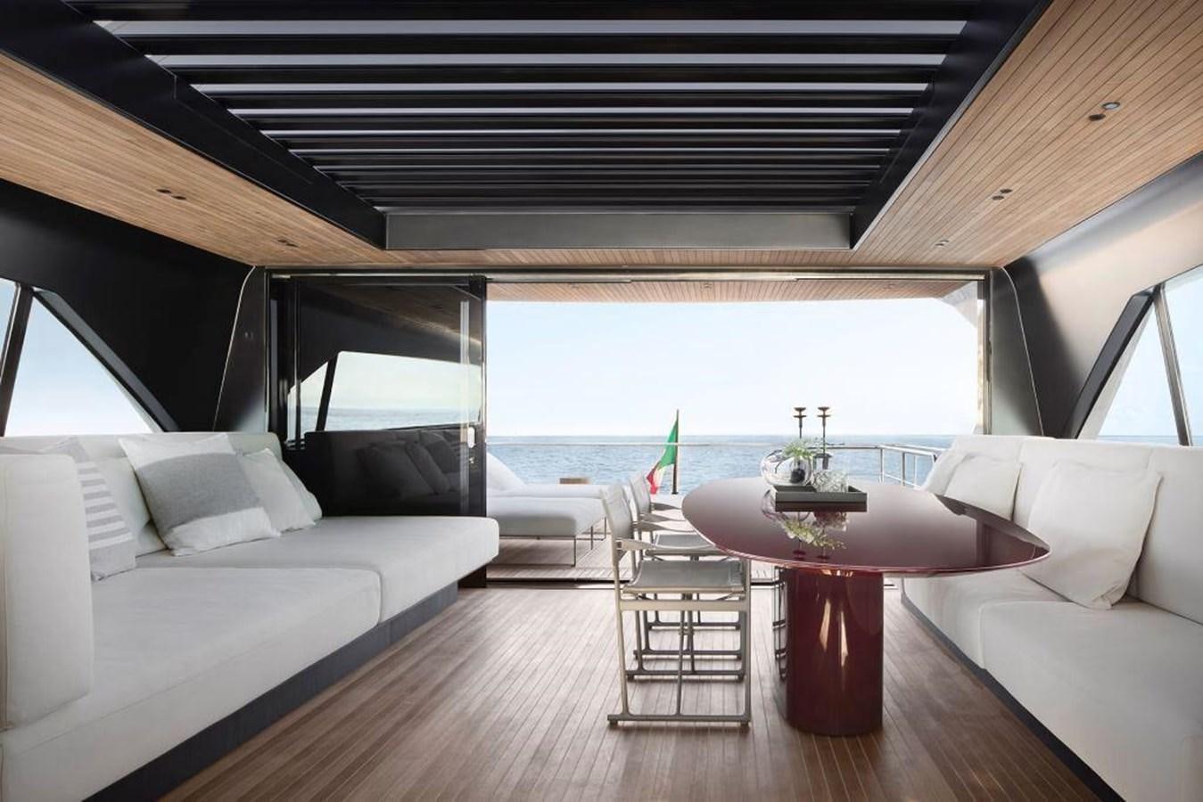 a living room with a couch and a table aboard HM 1 Yacht for Sale