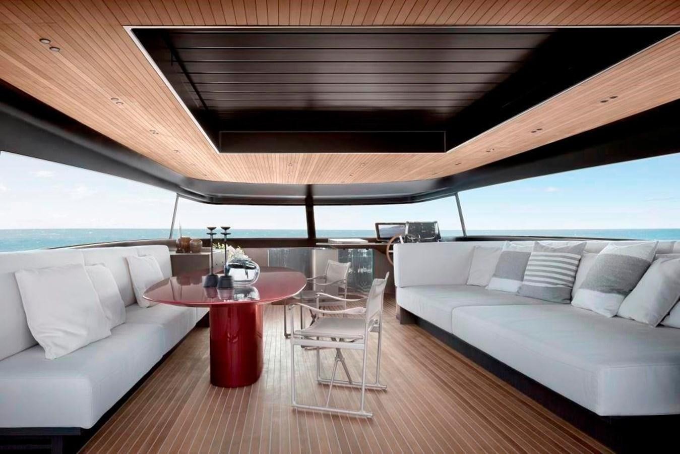 a living room with a couch and a table aboard HM 1 Yacht for Sale
