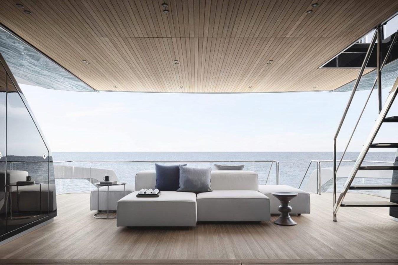 a large living room with a large balcony overlooking the ocean aboard HM 1 Yacht for Sale