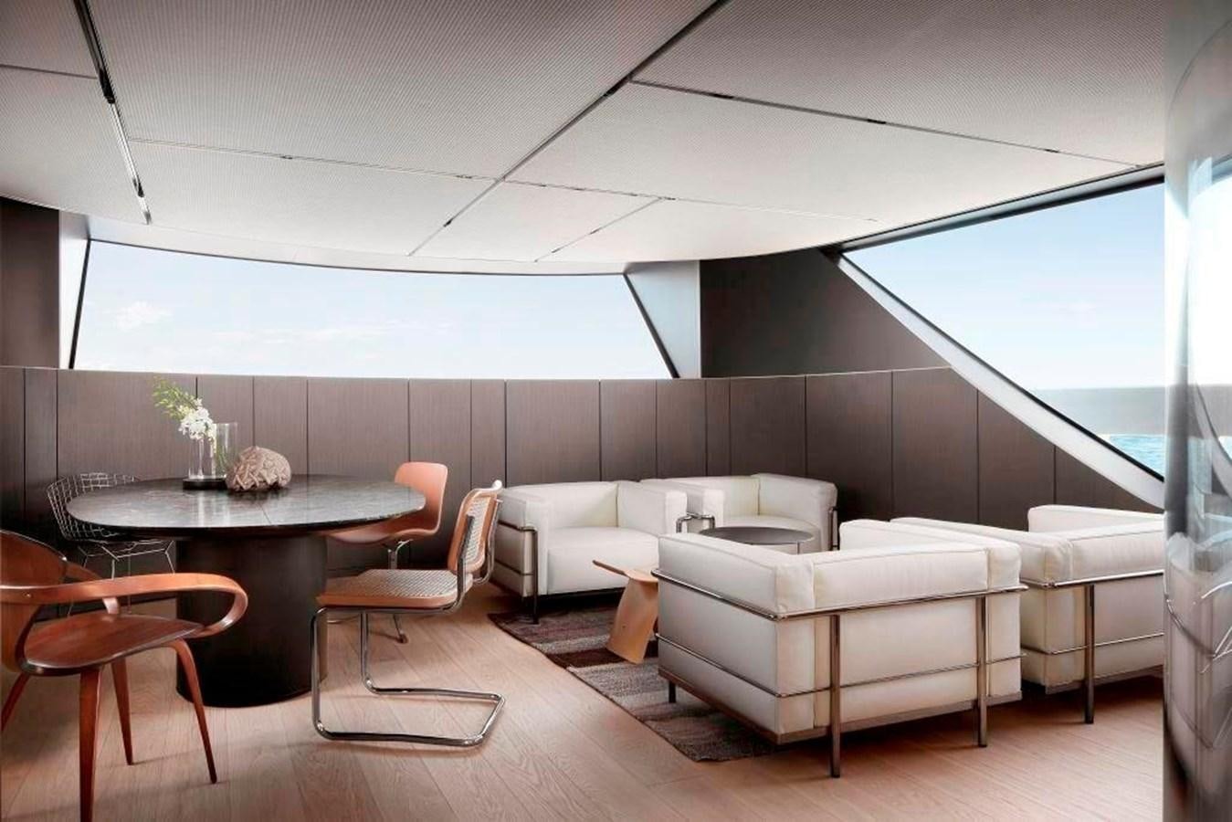 a room with a table and chairs aboard HM 1 Yacht for Sale