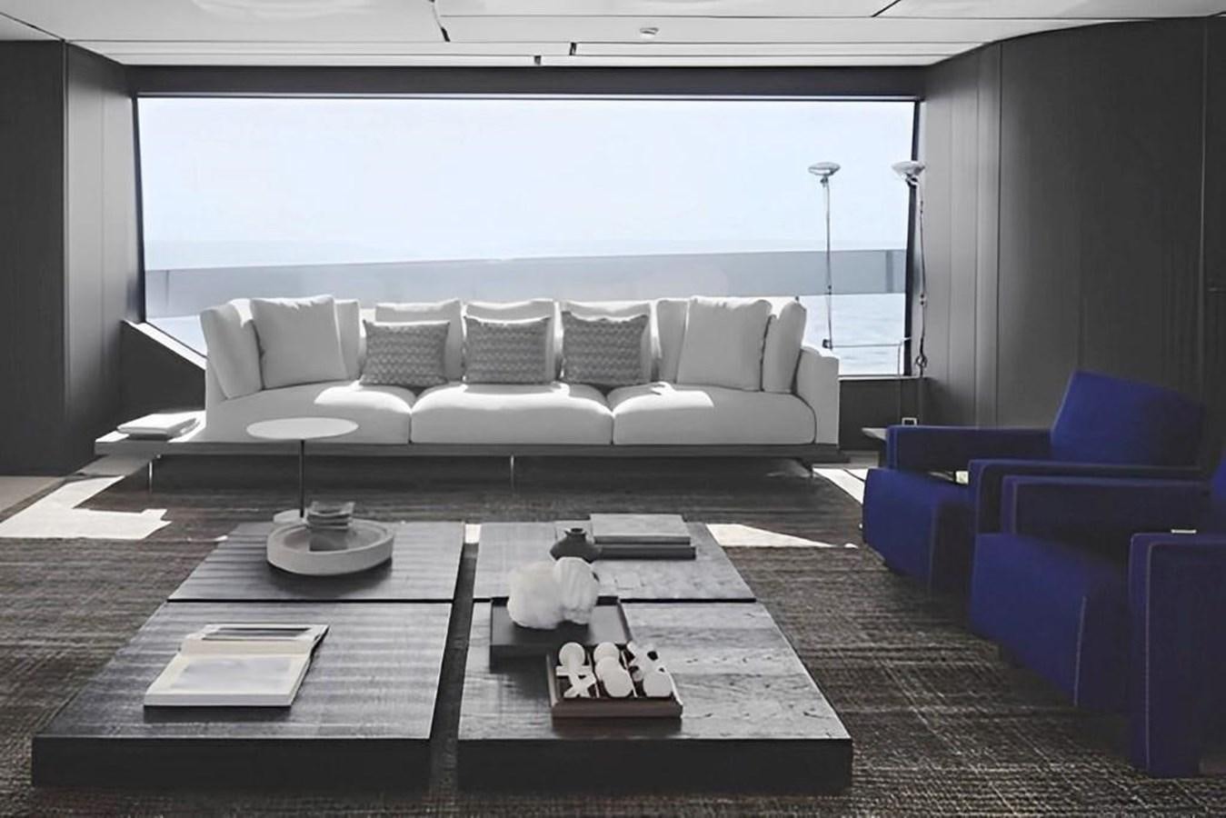 a living room with a couch and a table aboard HM 1 Yacht for Sale
