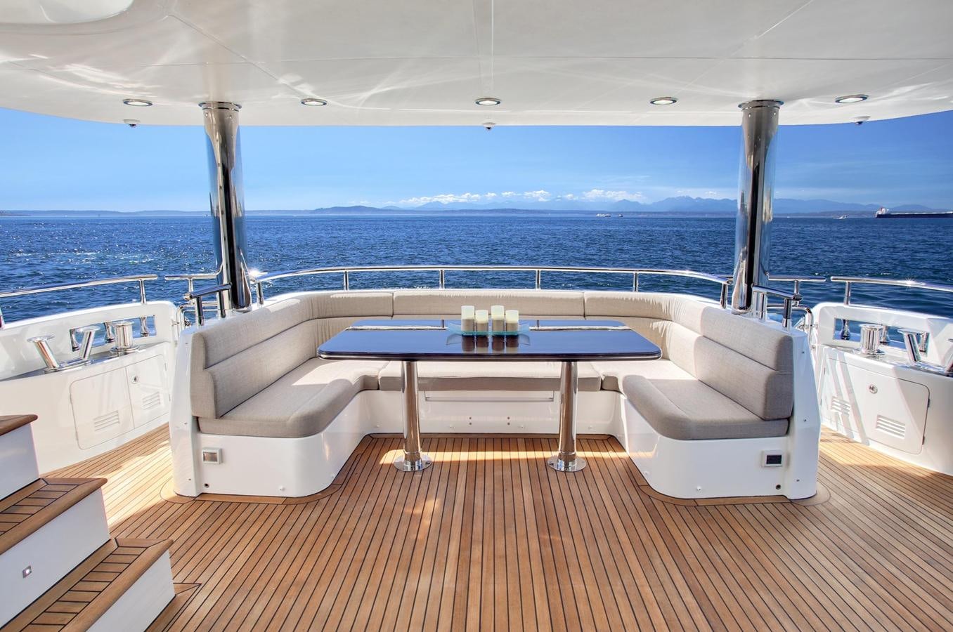 a deck with a pool and a table on it aboard 2025 SELENE 92 EXPEDITION YACHT Yacht for Sale