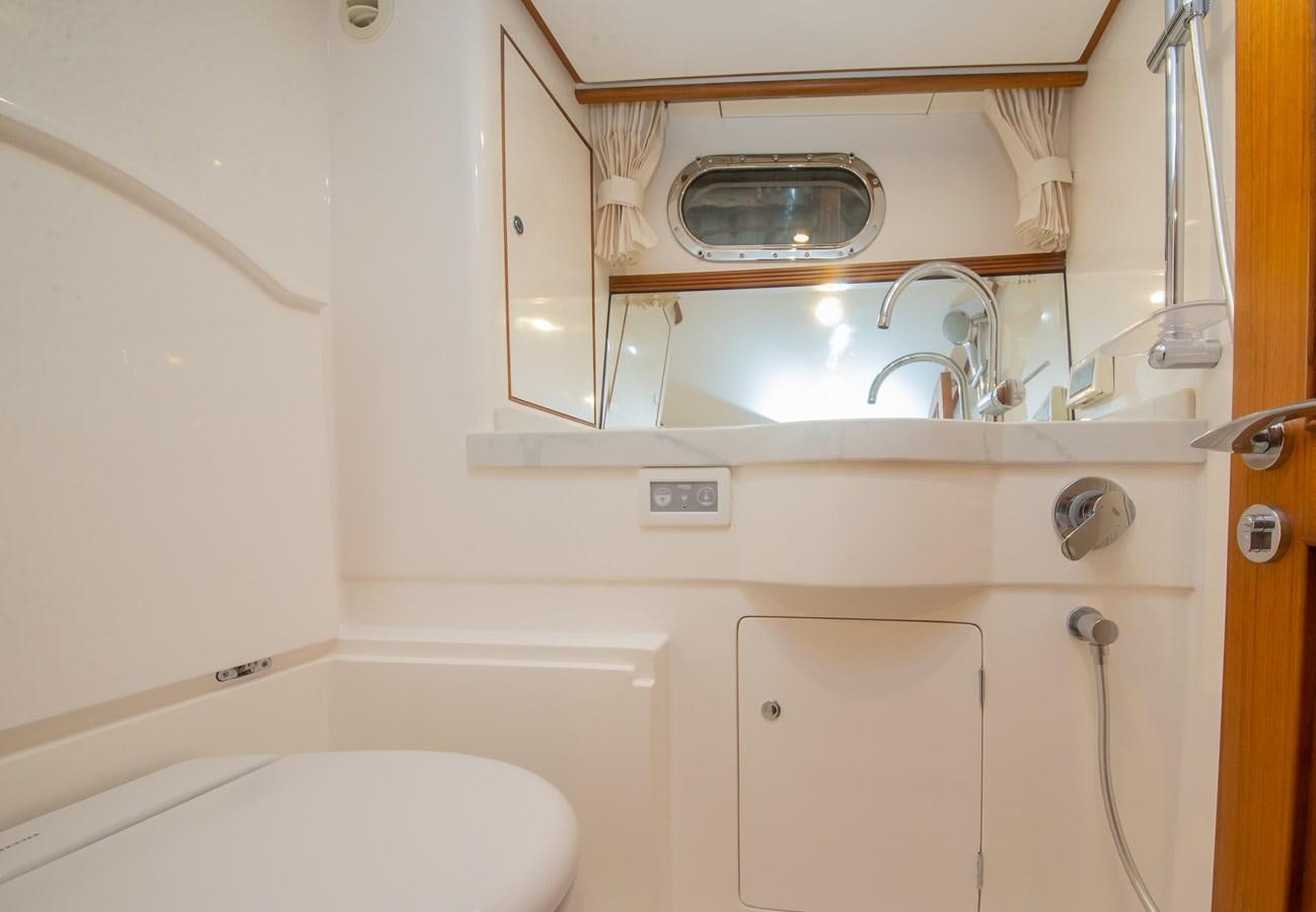 a bathroom with a sink and a bathtub aboard 2024 SELENE 62 Yacht for Sale
