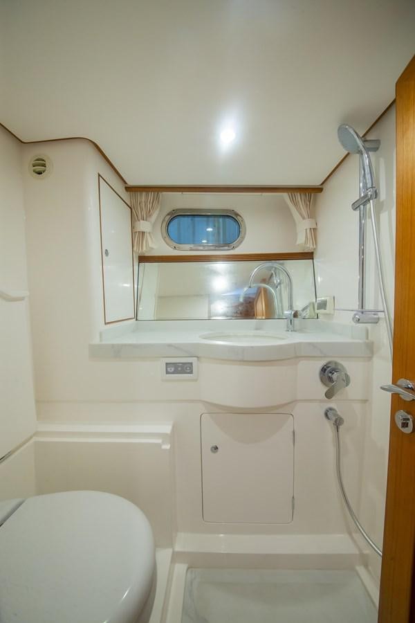 a bathroom with a sink and toilet aboard 2024 SELENE 62 Yacht for Sale