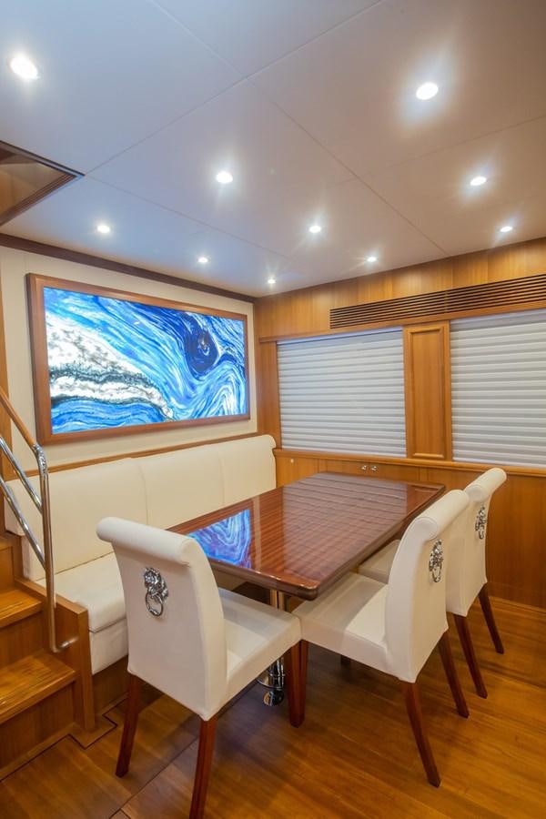 a room with a table and chairs aboard 2024 SELENE 62 Yacht for Sale