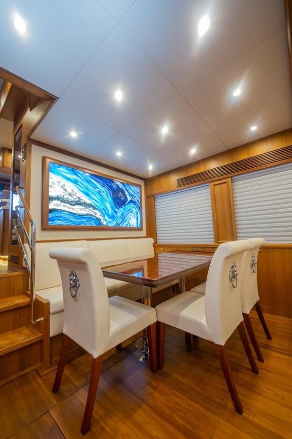 a room with a table and chairs aboard 2024 SELENE 62 Yacht for Sale