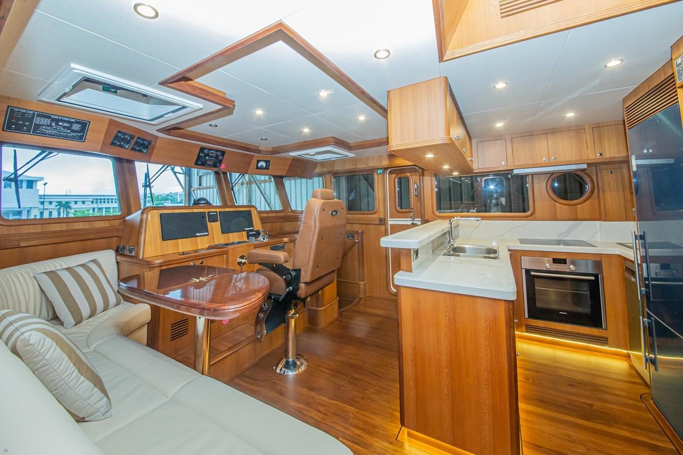 a kitchen and living room aboard 2024 SELENE 62 Yacht for Sale