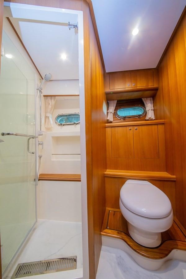 a bathroom with a toilet and a sink aboard 2024 SELENE 62 Yacht for Sale