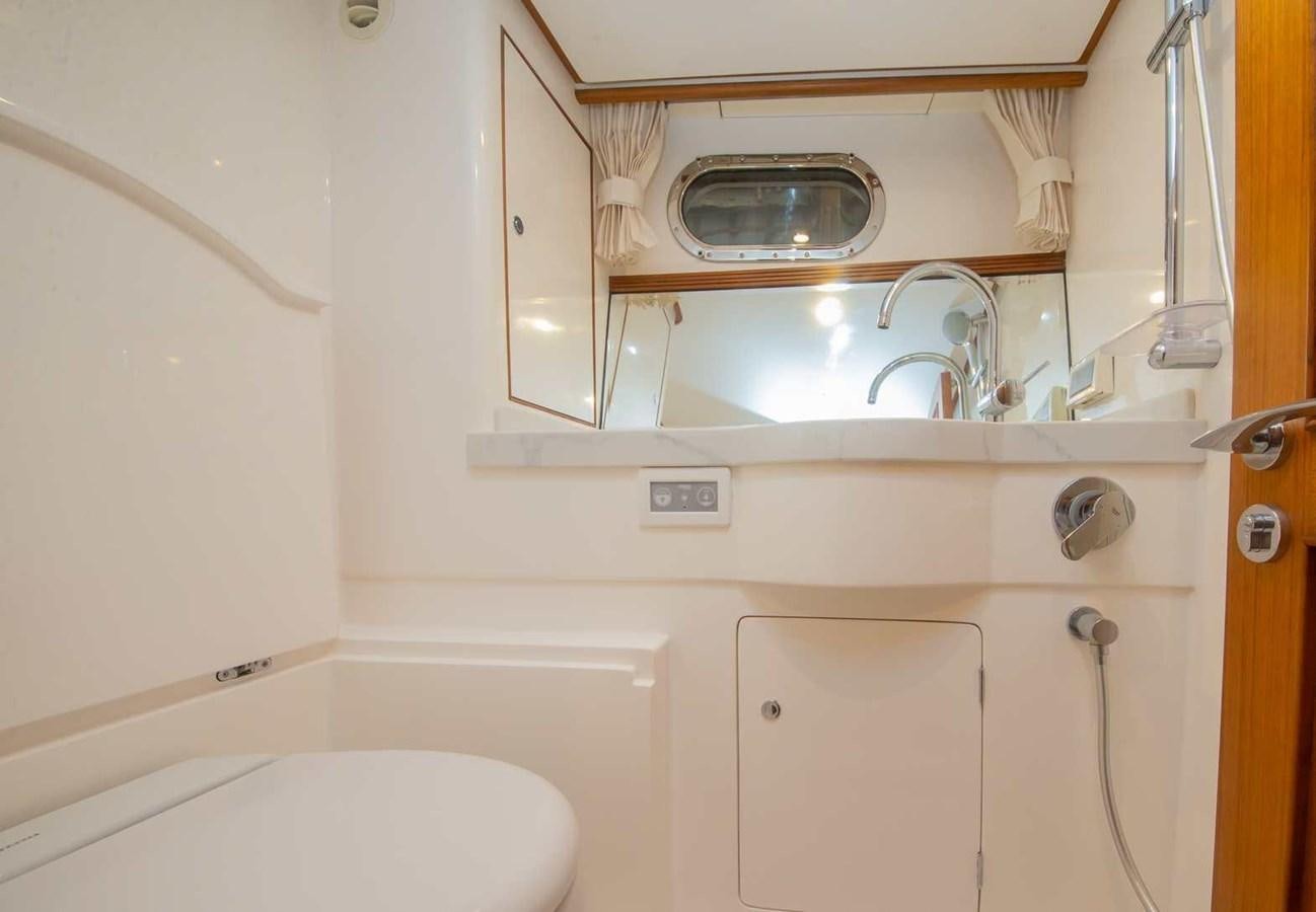 a bathroom with a sink and a bathtub aboard 2024 SELENE 62 Yacht for Sale