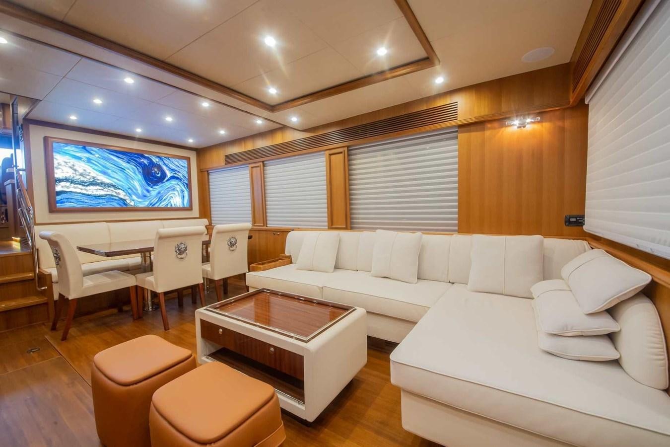 a living room with a large screen aboard 2024 SELENE 62 Yacht for Sale