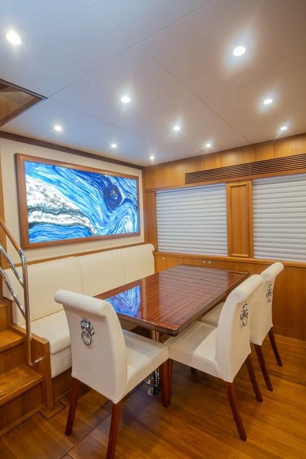 a room with a table and chairs aboard 2024 SELENE 62 Yacht for Sale