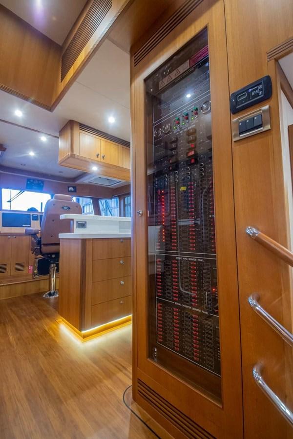 a server room with a glass case aboard 2024 SELENE 62 Yacht for Sale