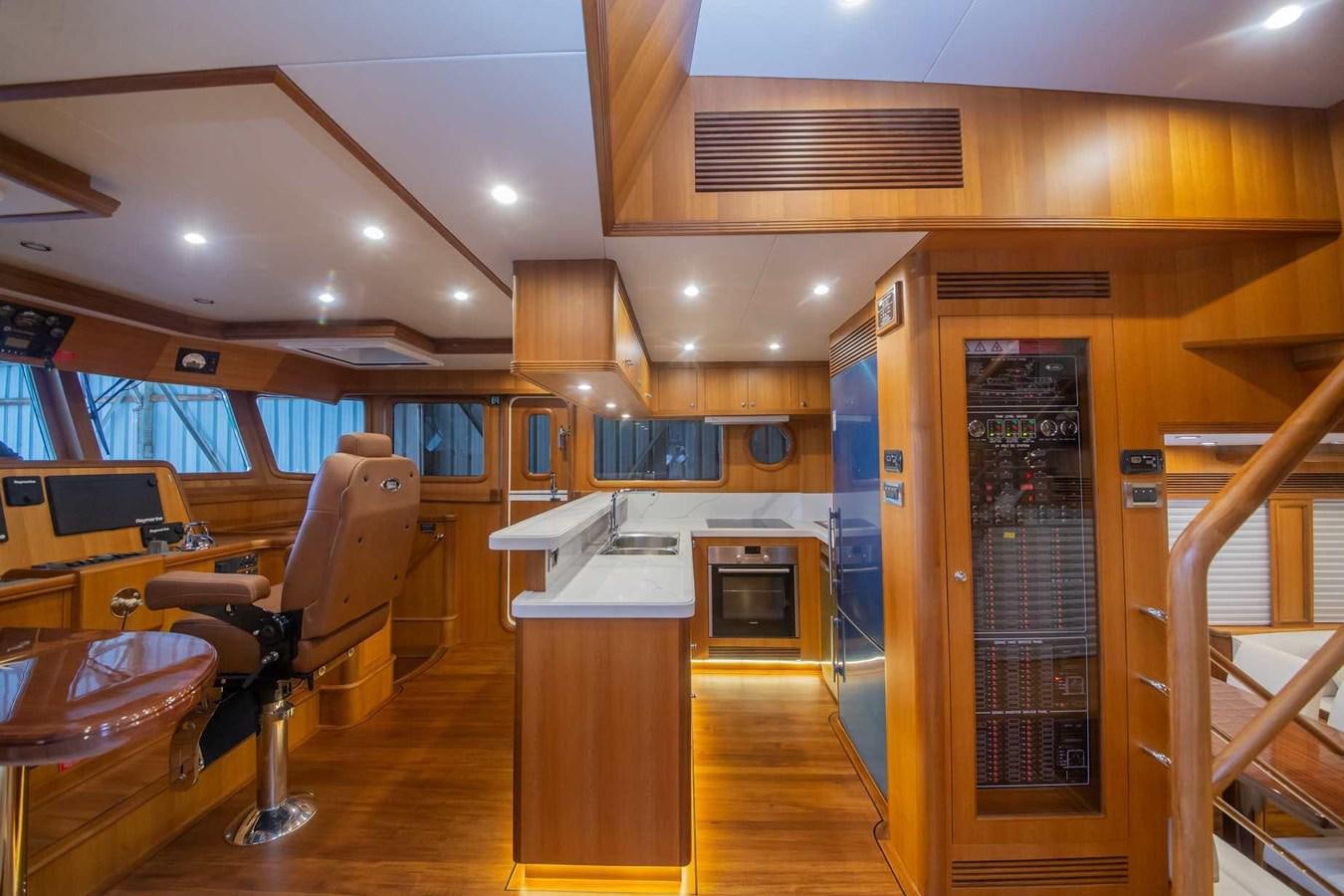 a room with a fireplace and a wood floor aboard 2024 SELENE 62 Yacht for Sale
