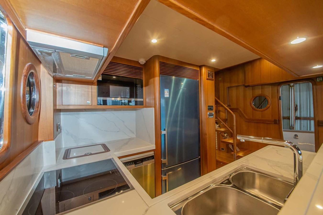 a kitchen with a large refrigerator aboard 2024 SELENE 62 Yacht for Sale