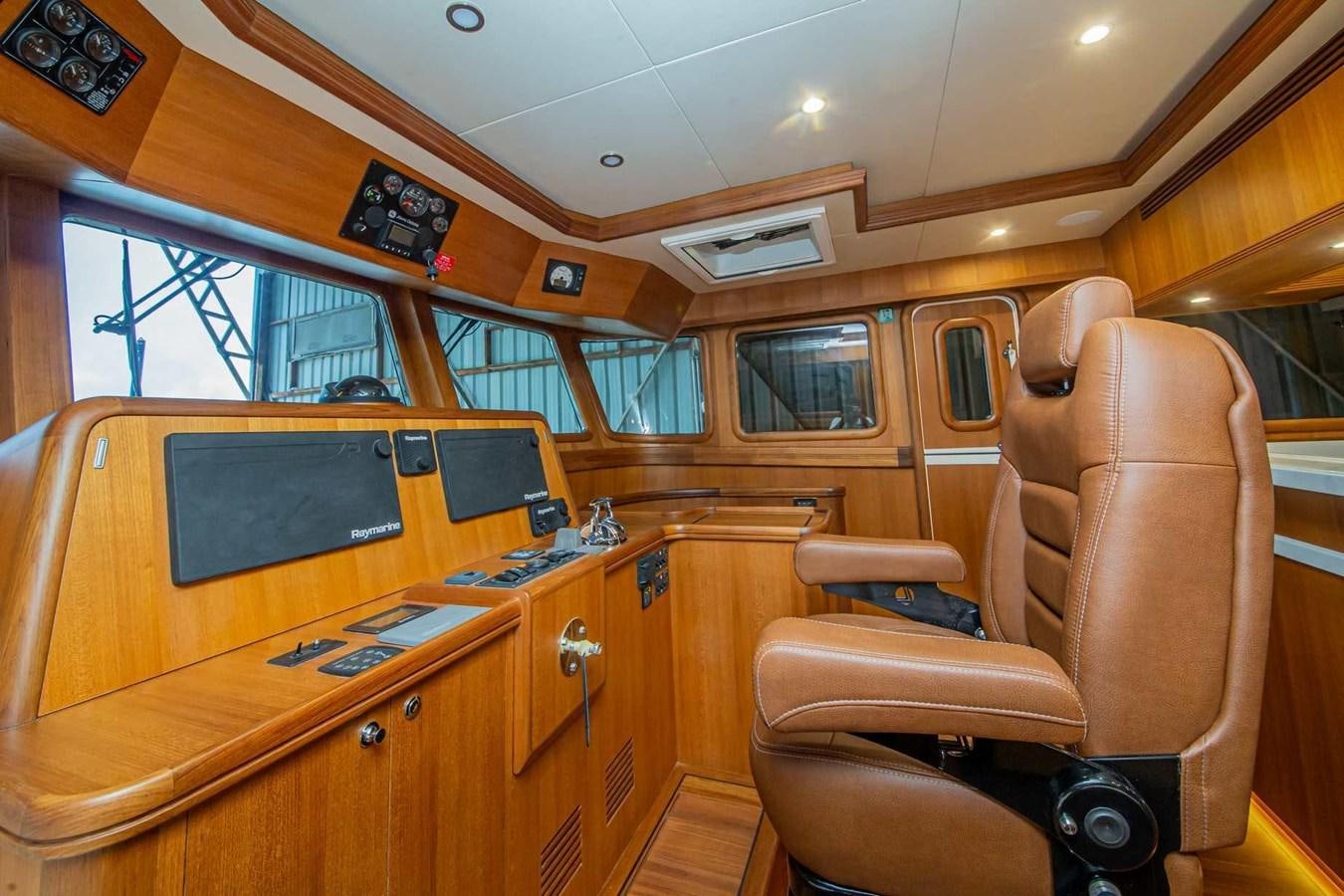 a room with a desk and chairs aboard 2024 SELENE 62 Yacht for Sale