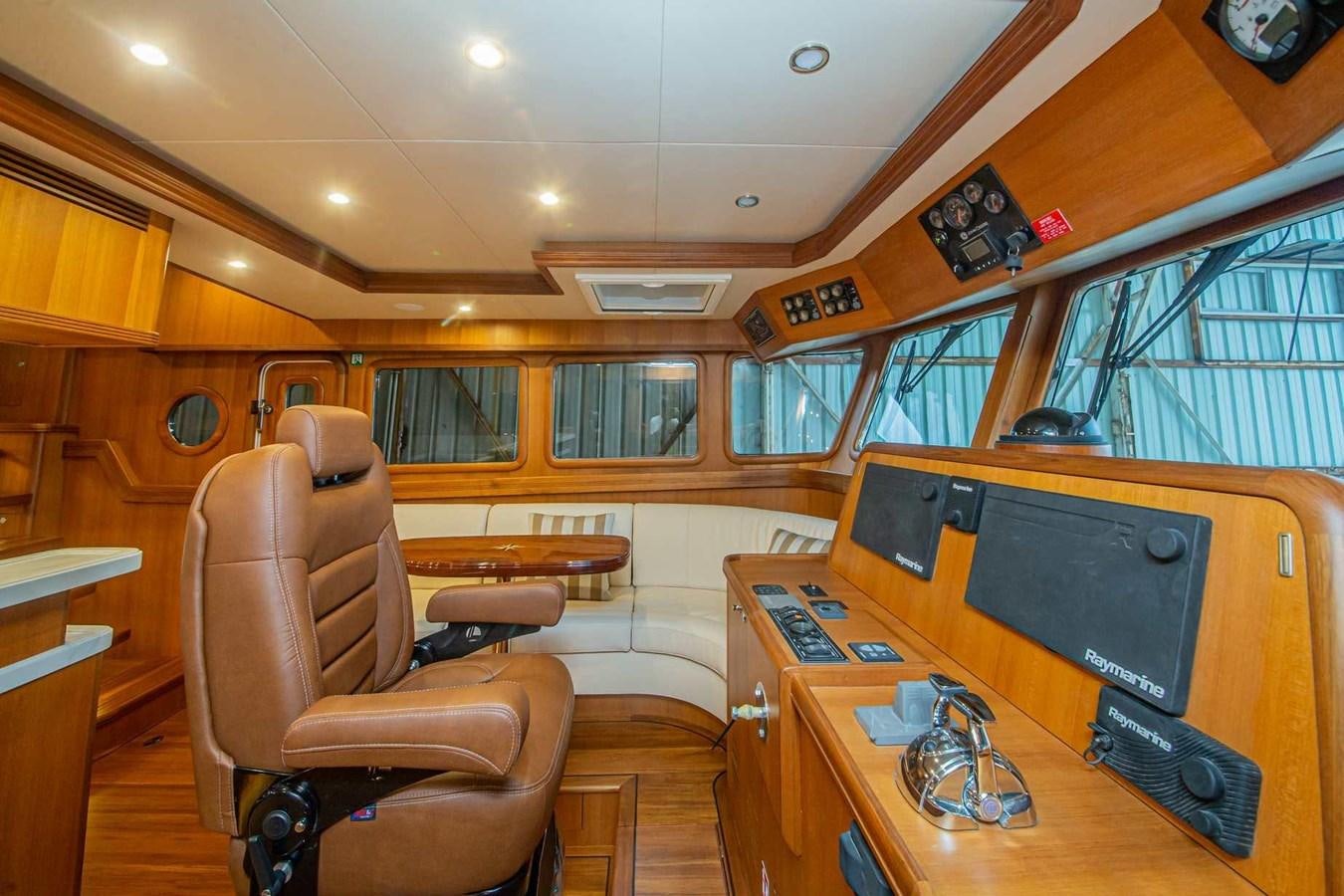 a room with a desk and chairs aboard 2024 SELENE 62 Yacht for Sale