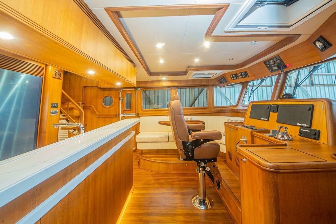 a room with a desk and chairs aboard 2024 SELENE 62 Yacht for Sale