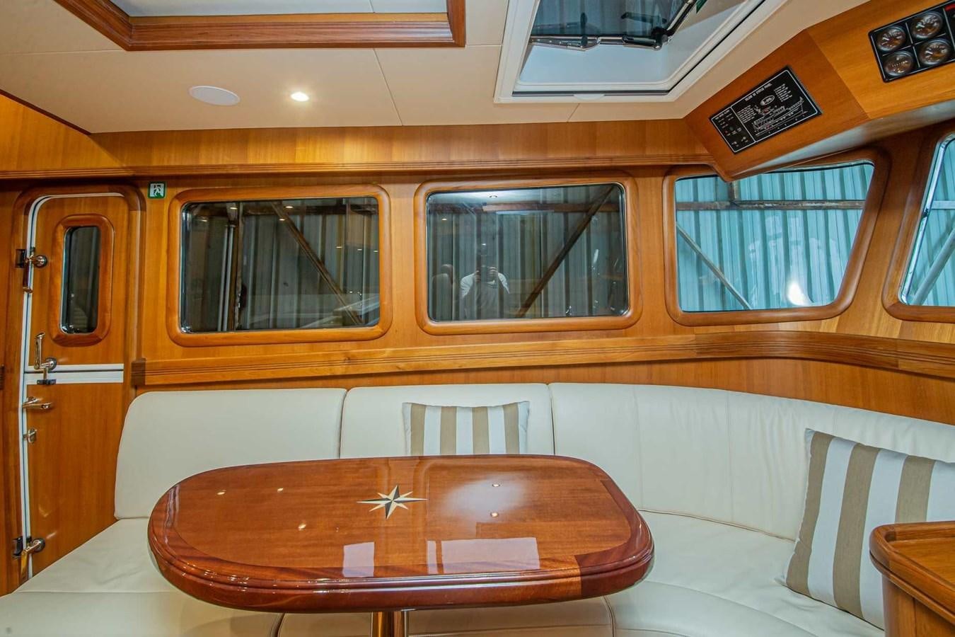 a wooden table in a room aboard 2024 SELENE 62 Yacht for Sale