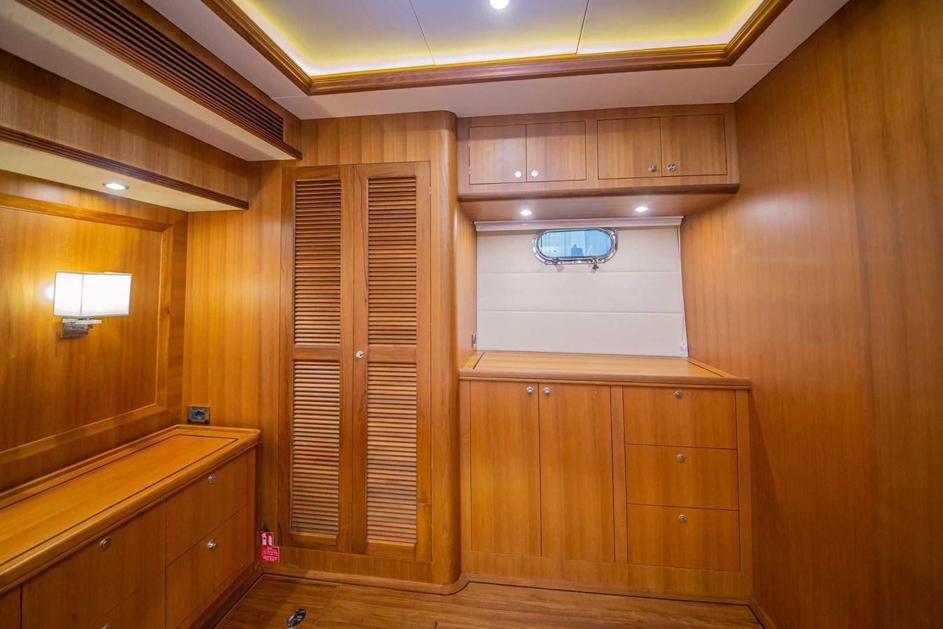 a room with wooden cabinets aboard 2024 SELENE 62 Yacht for Sale