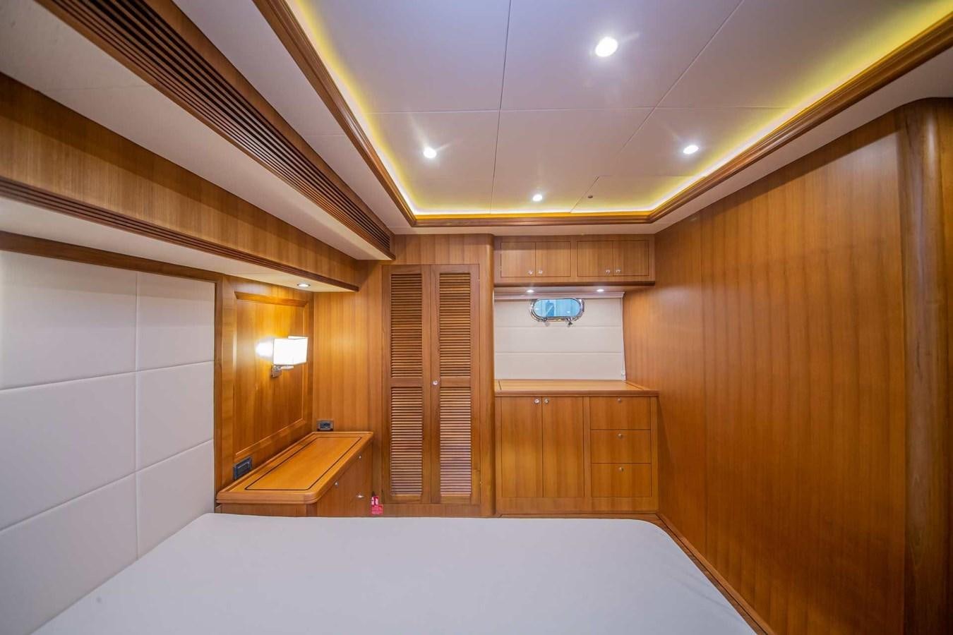 a room with a large white bathtub and wooden cabinets aboard 2024 SELENE 62 Yacht for Sale