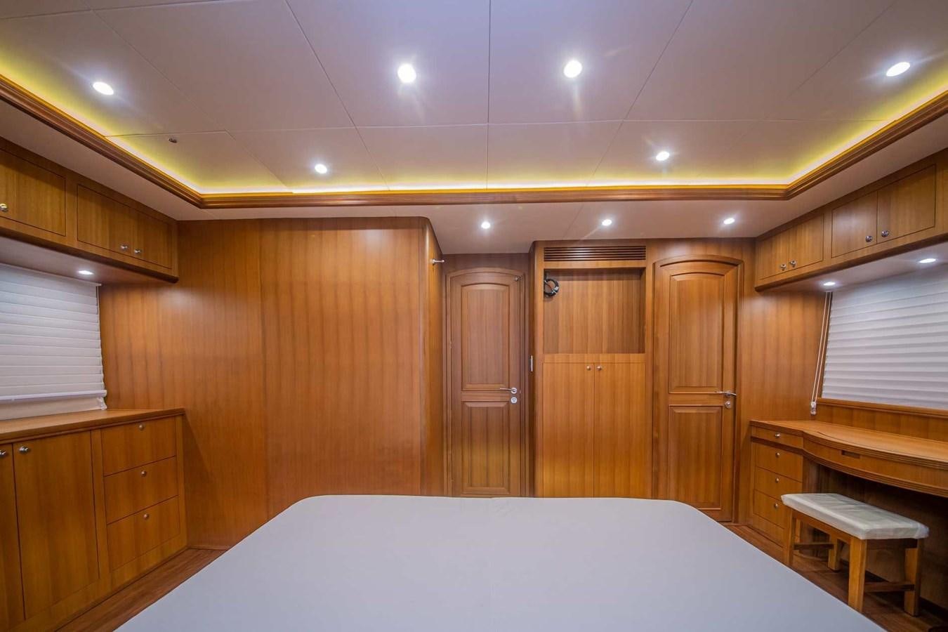 a room with a bed and cabinets aboard 2024 SELENE 62 Yacht for Sale