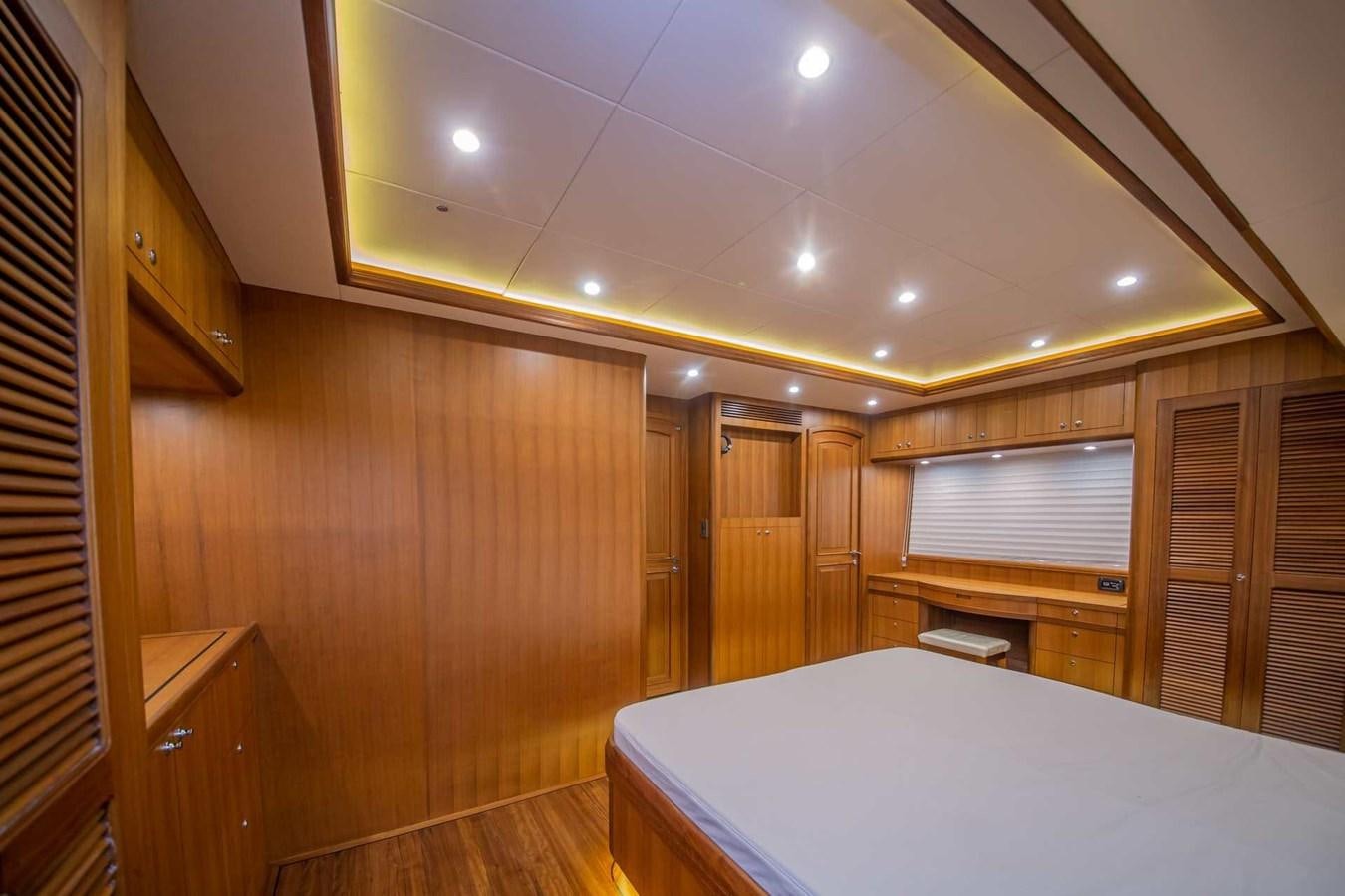 a room with a bed and a desk aboard 2024 SELENE 62 Yacht for Sale