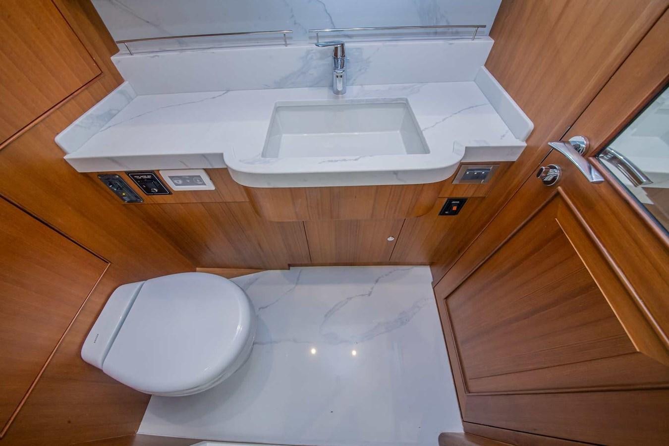 a bathroom with a sink and a toilet aboard 2024 SELENE 62 Yacht for Sale
