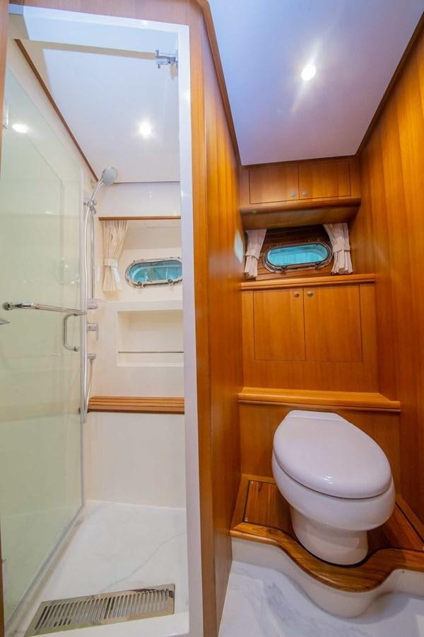 a bathroom with a toilet and a sink aboard 2024 SELENE 62 Yacht for Sale