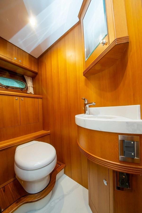 a bathroom with a toilet and a sink aboard 2024 SELENE 62 Yacht for Sale