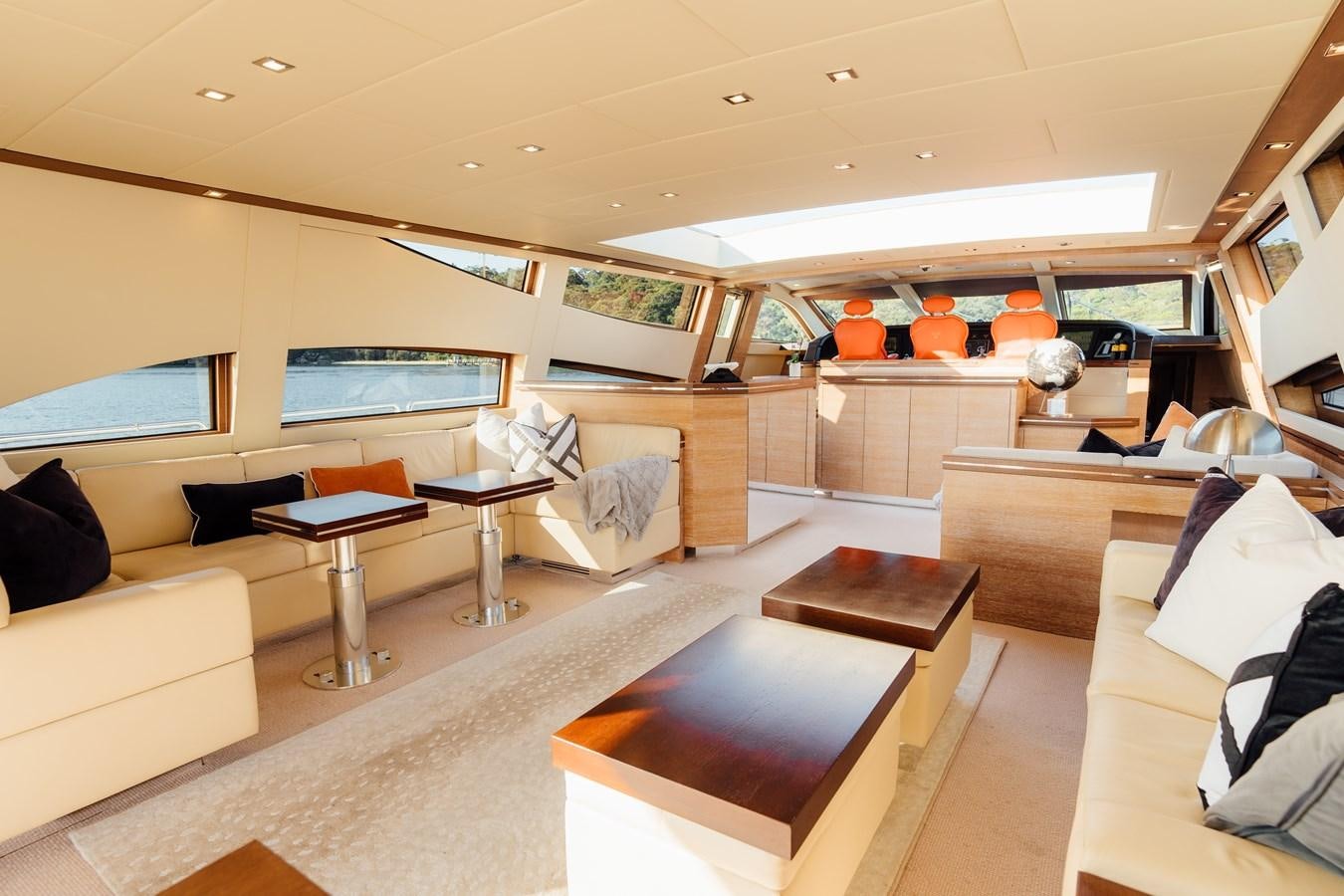 a room with a couch and a table aboard YOLO Yacht for Sale