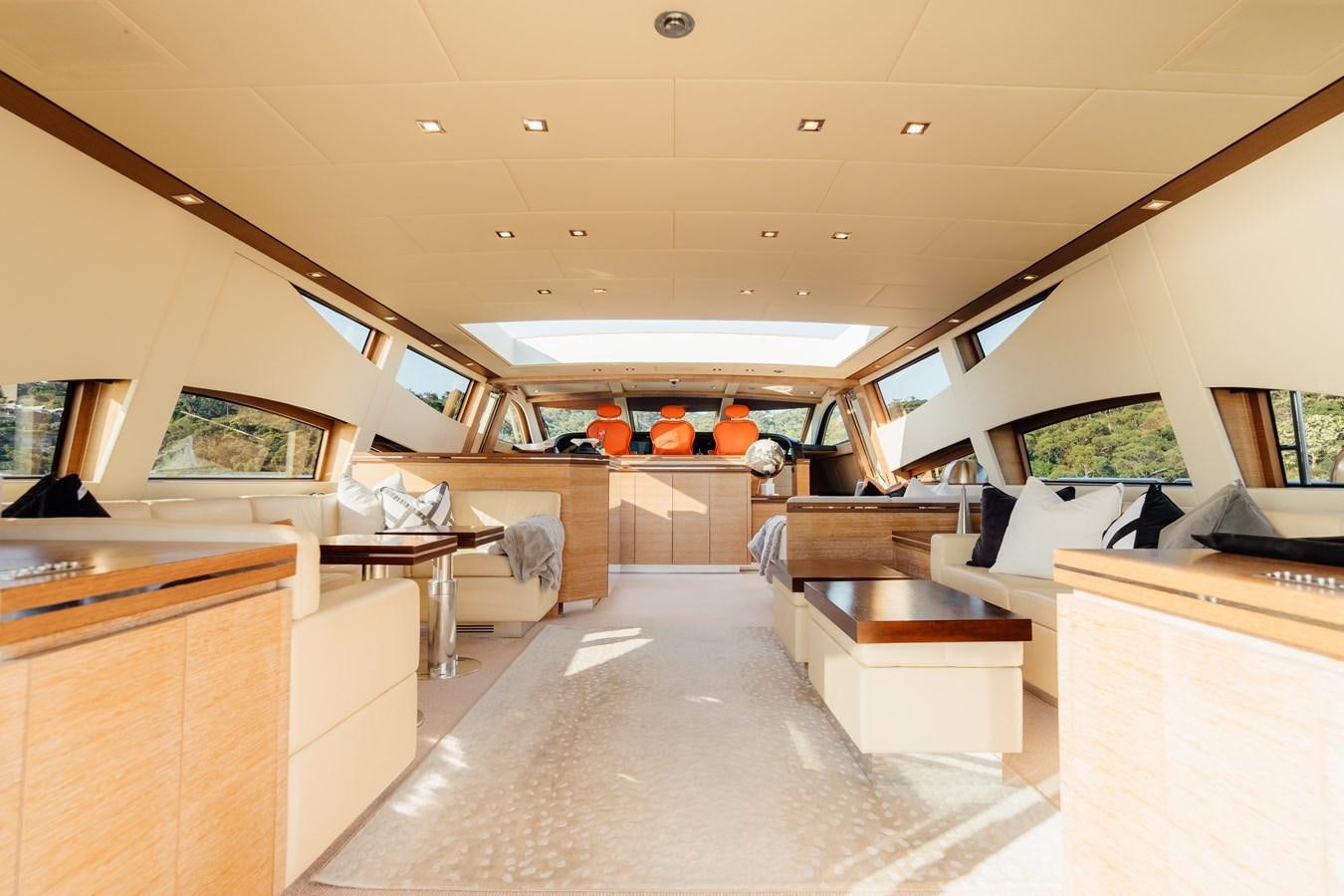 a room with a couch and a table aboard YOLO Yacht for Sale