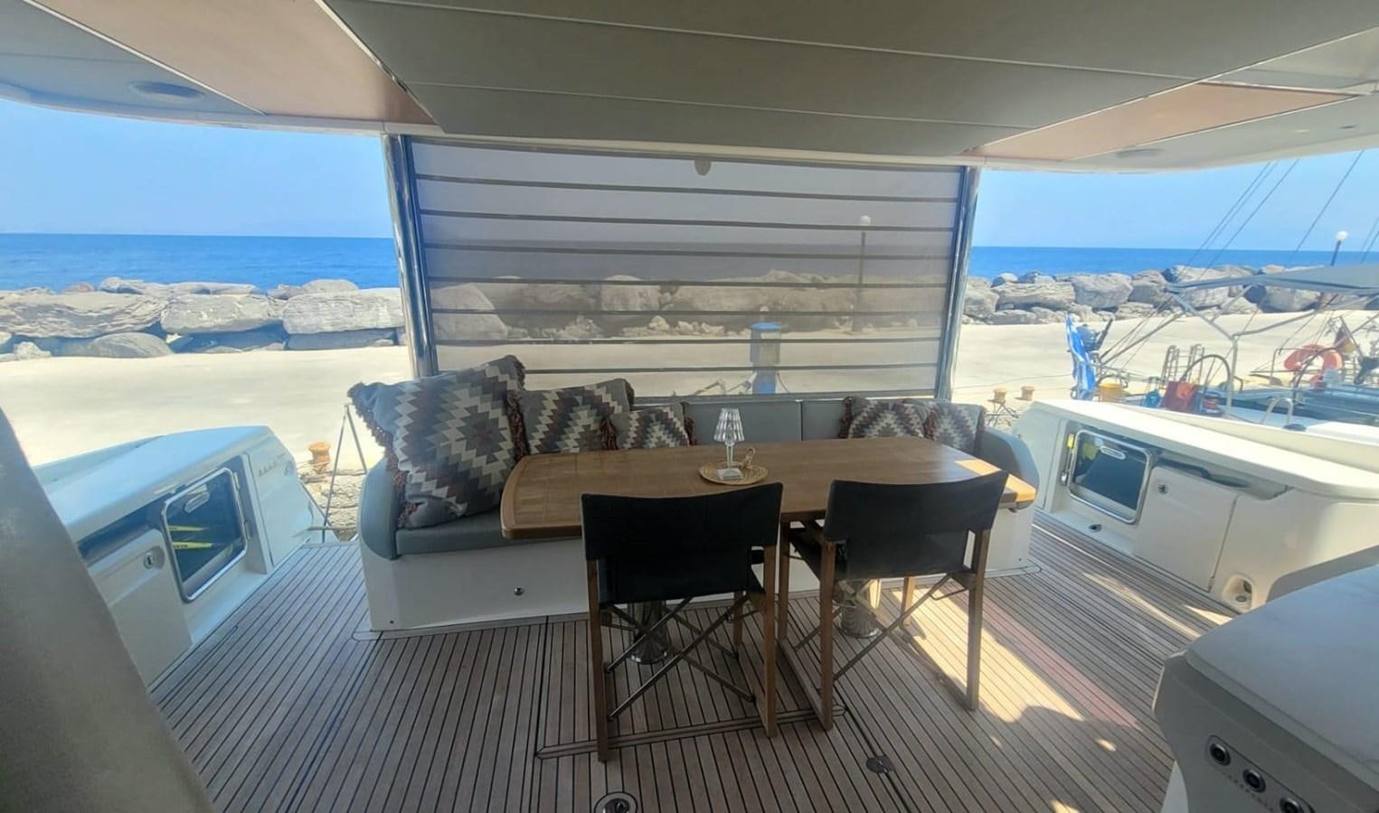 a living room with a couch and a table aboard ELYSIUM Yacht for Sale