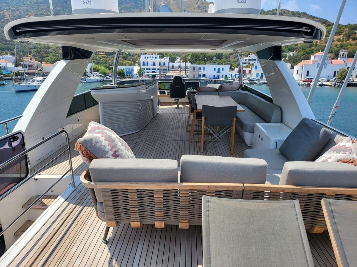 a deck with a couch and chairs on it aboard ELYSIUM Yacht for Sale