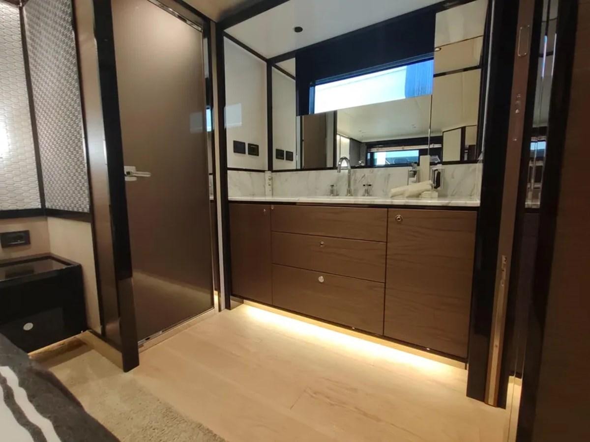 a bathroom with a large mirror aboard ELYSIUM Yacht for Sale